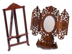 An Italian olive wood easel mirror: with oval bevelled mirror plate with folding panels to the