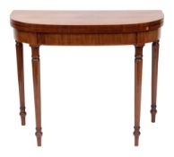 An early 19th Century mahogany and inlaid card table:, of D-shaped outline, bordered with lines,