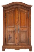 An Apprenticeman's beechwood armoire:, with a domed moulded cornice,