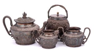 An Indian white metal three piece tea service: of cylindrical tapering form,