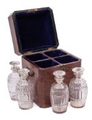 A George III mahogany and boxwood strung decanter case: of rectangular outline with canted corners