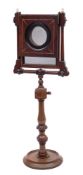 A 19th Century zogroscope: raised on a turned and knopped stem, mounted on a circular base,