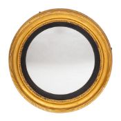 An early 19th Century giltwood circular convex mirror:,