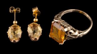 A citrine ring,: the rectangular cut citrine in a four claw setting,