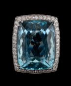 An aquamarine and diamond dress ring,: the rectangular cushion shaped aquamarine,