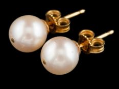A pair of cultured pearl ear studs:, the 8mm cultured pearls with post fittings, stamped 750.