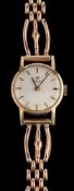 Omega, a lady's wristwatch,: the dial with baton markers and baton hands,