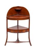 An early 19th Century mahogany and ebony strung bow-fronted corner washstand:,