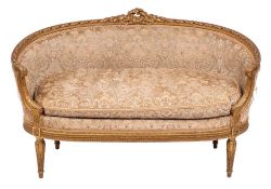 A carved and giltwood and velvet damask upholstered canapé in Louis XV / XVI Transitional style,