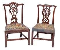 A George III carved mahogany dining chair: the back with shaped arched top rail with gadrooned and