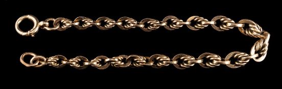 A 9 carat gold bracelet,: composed of fancy links, stamped 375, 20cm long, 18.4g.