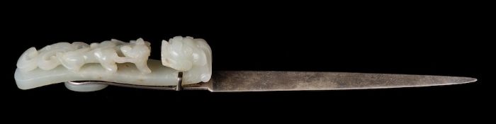 A Chinese silver-mounted carved jade belt hook: with dragon's head terminal and a sinuous chilong