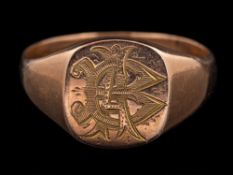A 9 carat gold signet ring,: the panel engraved with a monogram,