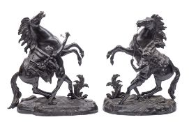 After Guillaume Cousteau (French 1667-1746) a large pair of bronze models of the Marley horses and