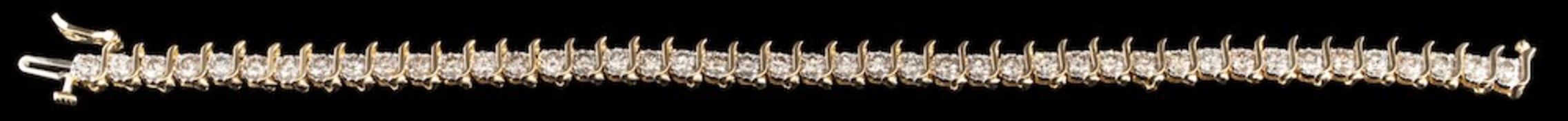 A diamond line bracelet,: the chevron links set throughout with brilliant cut diamonds,