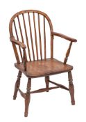 An early 19th Century elm, ash and beechwood stick back Windsor elbow chair:,