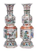 A pair of Chinese famille verte hexagonal section double-gourd vases: painted with alternating