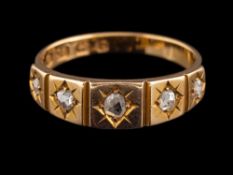 A late Victorian 18 carat gold and diamond ring,: set with five rose cut diamonds,