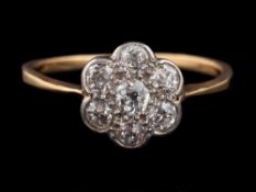 A 1920s diamond cluster ring,: set with old brilliant cut diamonds, approximately 0.