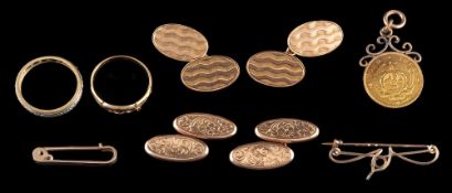 A pair of 9 carat gold cufflinks,: the double sided cufflinks with oval shaped panels,