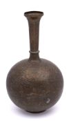 A large Indo-Persian bronze bottle vase: the circular body with slender knopped and flared neck,