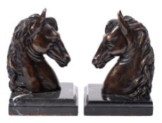 A pair of 20th century bronze book ends,