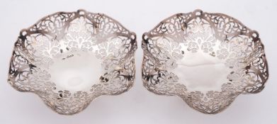 A pair of Elizabeth II silver sweetmeat baskets, maker Douglas Heeley, Sheffield,