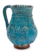 A Iranian possibly Kashan pottery mug: of bulbous form the body moulded in low relief with a band