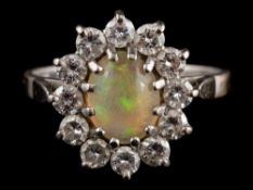An 18 carat gold opal and diamond ring,