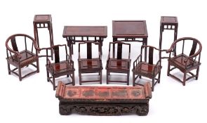 A collection of Chinese hardwood and lacquer miniature furniture and stands: comprising a pair of
