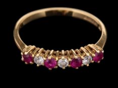 An 18 carat gold ruby and diamond ring,