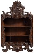 A 19th Century carved oak hanging open cabinet:,