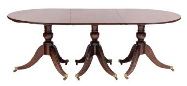 A mahogany D-end three pillar dining table:, the top with a rounded edge,