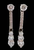 A pair of diamond ear pendants,