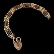 A 9 carat gold gate link bracelet,: composed of polished links, with a 9 carat gold padlock clasp,
