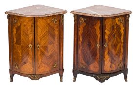 A matched pair of late 18th century French kingwood and gilt metal mounted serpentine fronted