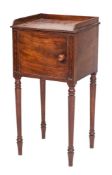 An early 19th Century mahogany pot cupboard:, with reeded edge and three quarter ledge gallery,