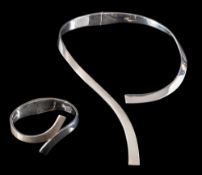 A silver necklace,: the hinged collar of plain polished design, stamped 950,