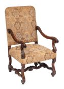 A carved walnut open armchair in the William and Mary taste:,