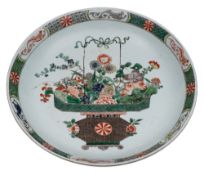 A Chinese famille verte 'basket of flowers' charger: finely enamelled with a large basket of