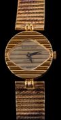 Beuche Girod, a 9 carat gold wristwatch,: the red circular dial, on a woven strap,