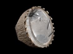 A silver and rutilated quartz dress ring,