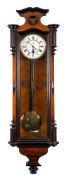 A 'Vienna' regulator wall clock: the eight-day duration weight-driven timepiece movement having a