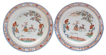 A pair of Chinese verte-imari chargers: each painted with a deer pulling a cart containing a