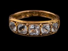A 15 carat gold rock crystal ring,: set with five square cut rock crystals,