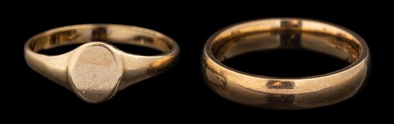 A 9 carat gold ring,: the plain polished band, stamped 375 with import marks,