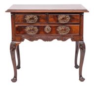 A George II mahogany and later carved lowboy:, the rectangular top with a moulded edge,