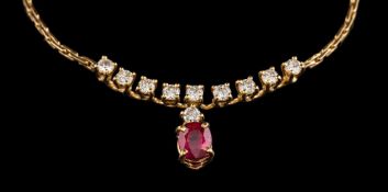 An 18 carat gold ruby and diamond necklace,: the oval cut ruby in a four claw setting,