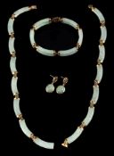 A jadeite necklace,: the polished curved panels of jadeite with belcher links in between,