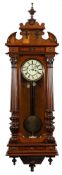 A 'Vienna' regulator wall clock: the eight-day duration weight-driven movement striking the hours